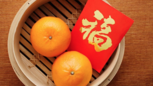 red-envelope-and-oranges